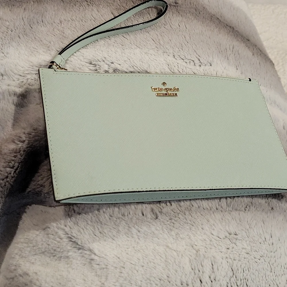 kate spade mint green wristlet clutch with gold logo